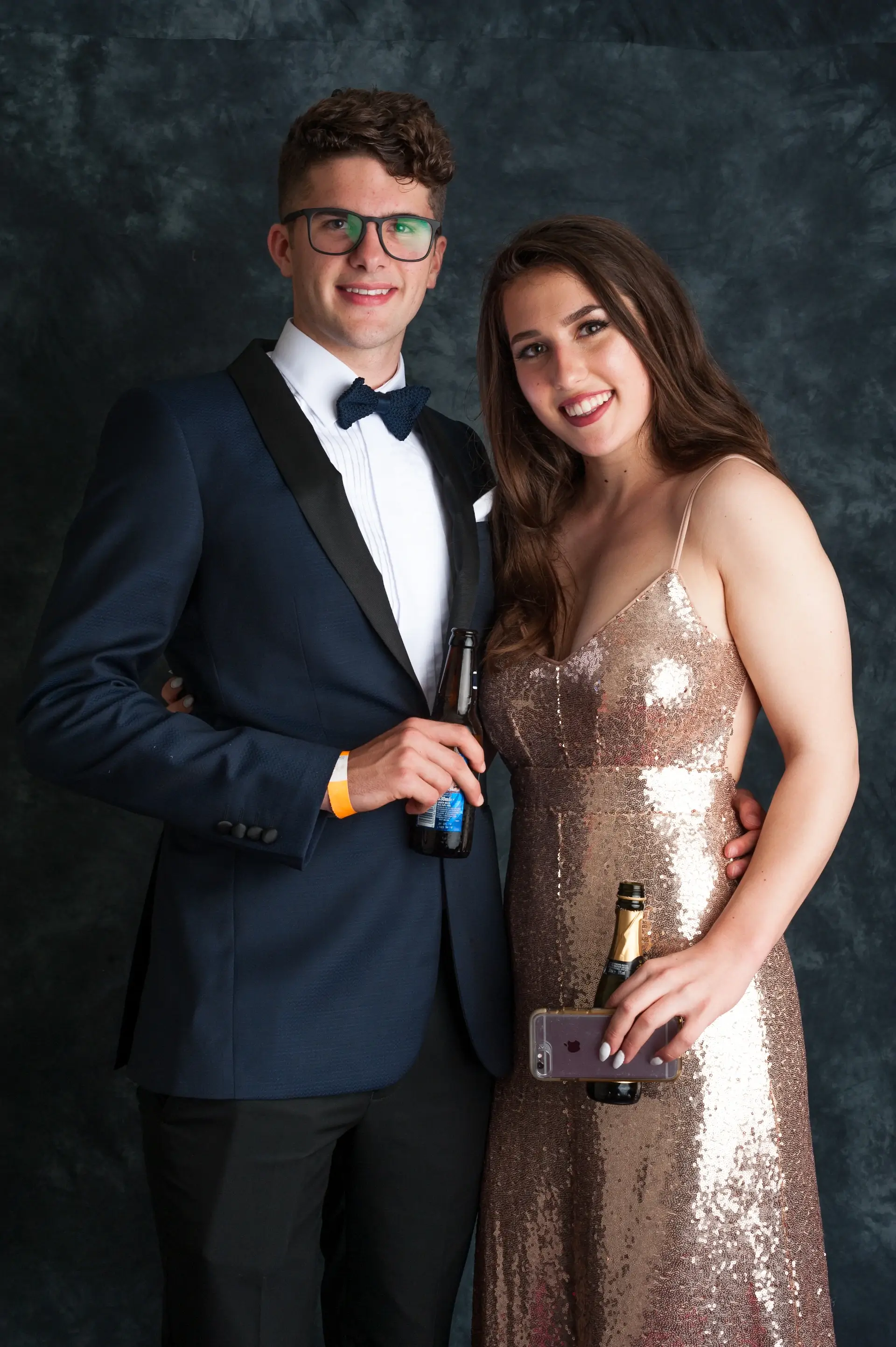 Couple sharing champagne at formal celebration