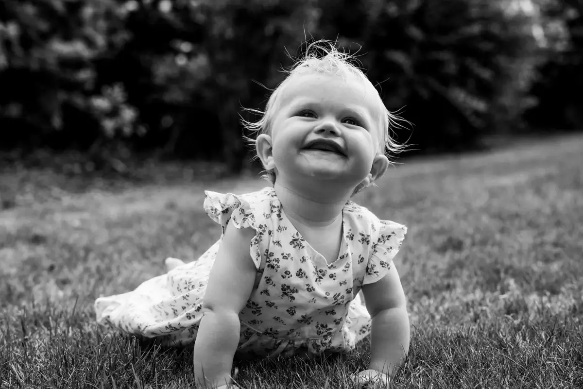 Joyful child laughing in black and white portrait
