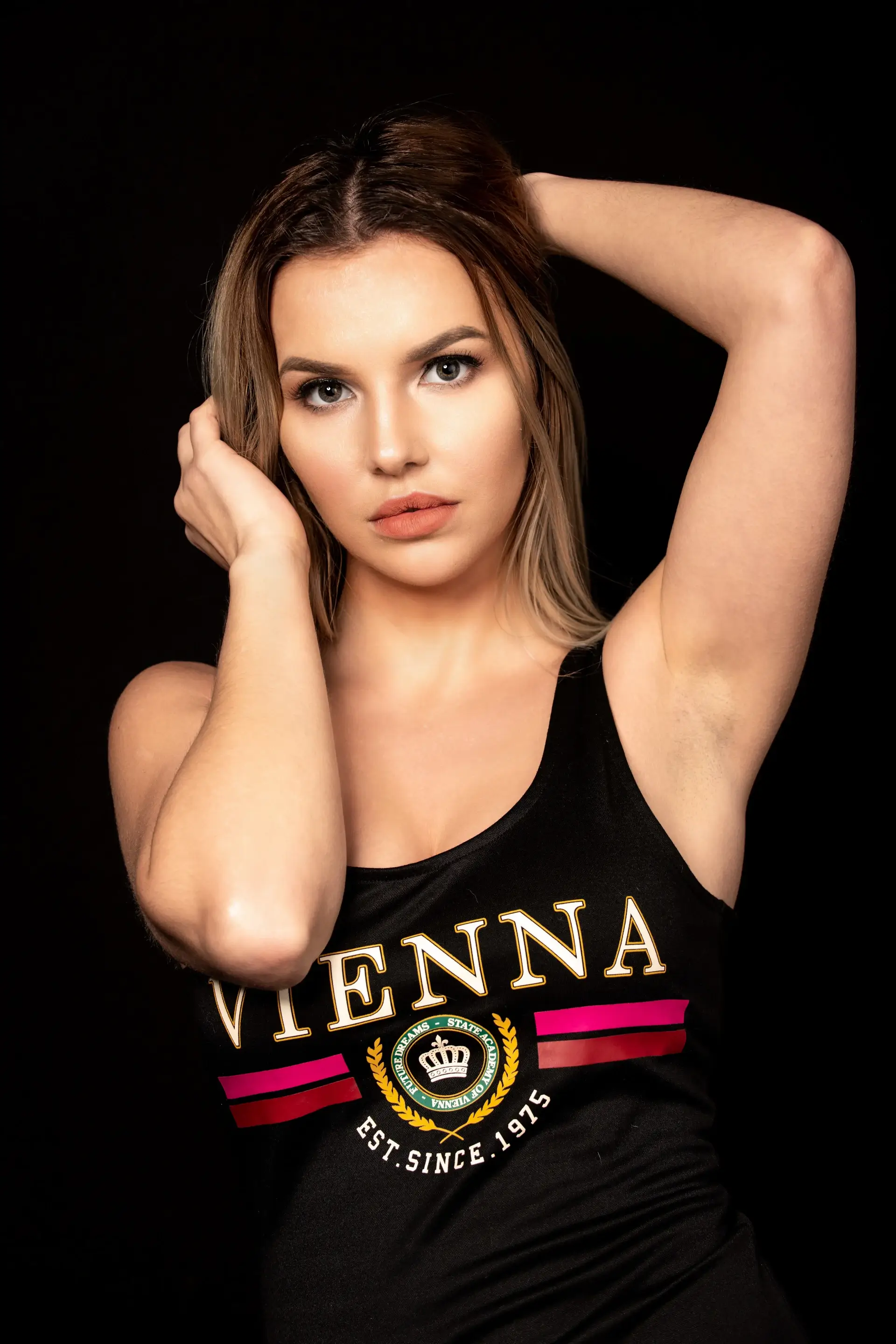 Blonde model in black top creative portrait pose